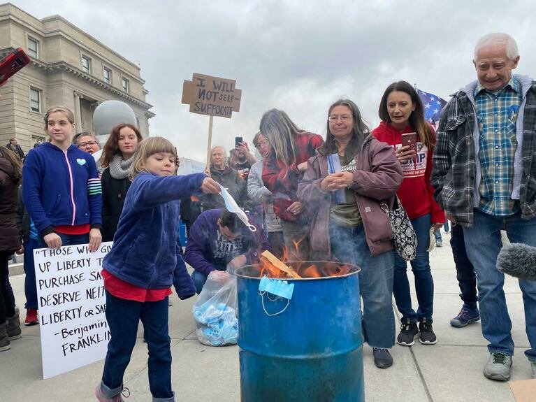 People burning mask